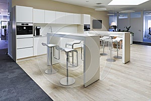 a modern office floor there is a beautiful office kitchen for the employees