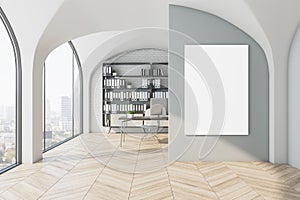 Modern office interior with blank mock up poster on wall, designer desktop and computer, bookcase with folders, window with city