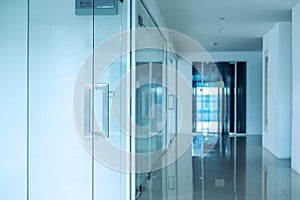 Modern office interior, Blue toned, selective focus on doorknob