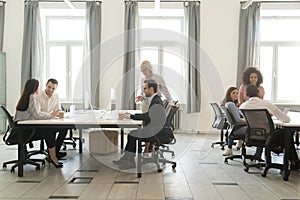 Modern office interior with business team people working on computers