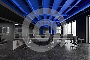 Modern office interior with coworking and glass conference boxes, window