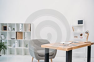 modern office interior with papers and digital tablet