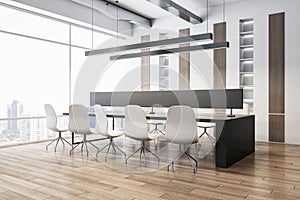 Modern office interior with a wooden conference table, white chairs, and large windows, showcasing a concept of corporate design.