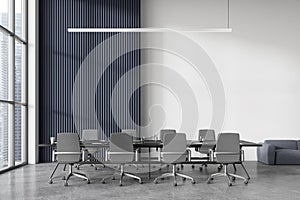 Modern office meeting room interior with table and armchairs, panoramic window