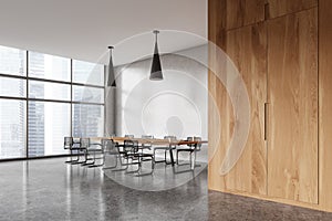 Modern office meeting room interior with table and chairs, panoramic window