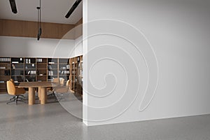 Modern office meeting room interior with table and chairs, shelf and mockup wall