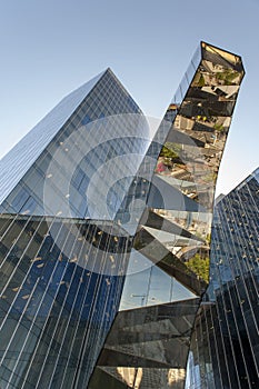 Modern office skyscraper of glass and reflections