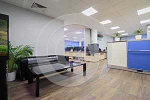 Modern office space lit by artificial light