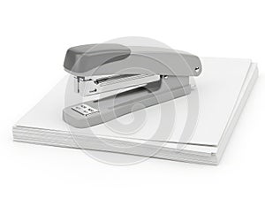 Modern office stapler on stack of paper