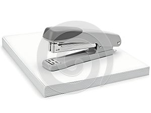 Modern office stapler on a stack of paper