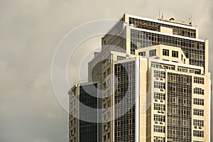 Modern office with tinted windows on cloudy day