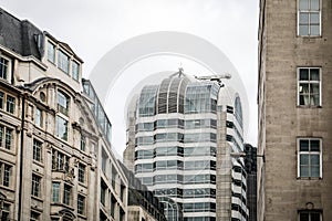 Modern Office Tower Surrounded by Historic City Buildings