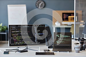 Modern Office Workspace Featuring Coding Screens