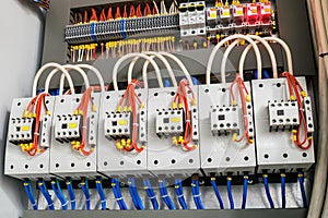 A modern open fuse box contains a lot of automata, connectors, relays, and magnet starters. Distributive electrical box photo
