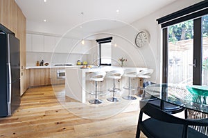 Modern open plan kitchen with island bench photo