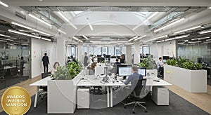 Modern open-plan office interior with bright lighting from overhead fixtures and