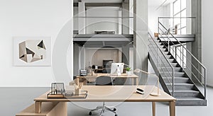 Modern open-plan office interior with desks, computers, and industrial staircase
