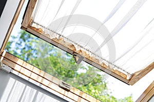 Modern open skylight roof window or mansard in home attic room