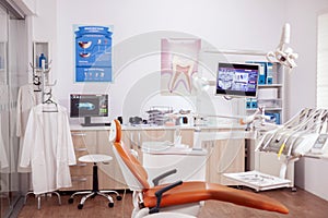 Modern orange dentist cabinet with sterile utensils