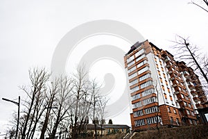 Modern orange residential multistory apartment buildings. Facade of new houses