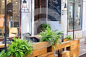 Modern outdoor cafe with flowers