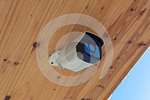 Modern Outdoor CCTV Camera on a Ceiling. Concept of Surveillance and Monitoring. Surveillance camera Anti-theft System Concept