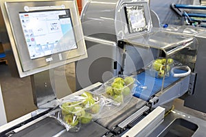 Modern packaging machine for fresh pears in a factory for food industry