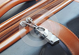 Modern padlock closeup on brown suitcase