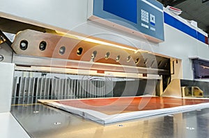 Modern paper guillotine with touch screen used in commercial printing industry