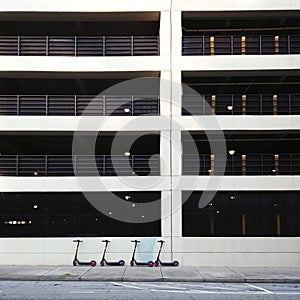 Modern Parking Deck Architecture and Parked Scooters, Urban Background.