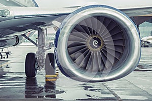 Modern passenger aircraft liner parked, view of the wing engine