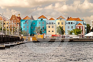 Modern pastel painted buildings beside the Queen Emma Bridge, Willemstad, Curaçao