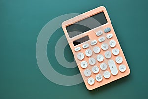 modern peach colour pastel calculator and white button on green background