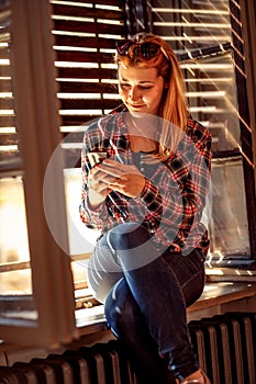 Modern people city lifestyle. urban girl holding a cellphone and