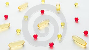 Modern Pharmaceuticals antibiotics pills capsule medicine background. different red and yellow jelly capsules on white background