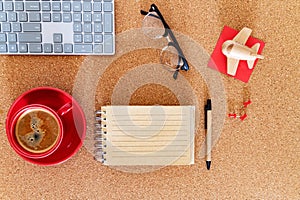 Modern planning workspace for trip. Overhead shot with notebook, keyboard, and espresso