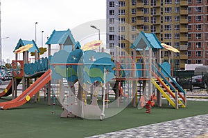 Modern Playground Equipment. Modern Colorful kids playground on yard in the park
