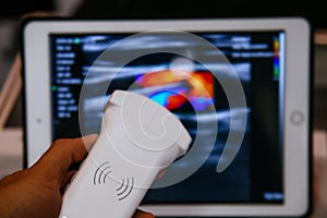 Modern portable ultrasound machine in clinic laboratory of sonography diagnostics