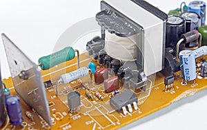 Modern printed-circuit board with electronic components on white