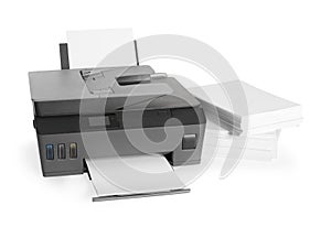 Modern printer and stack of paper on white background