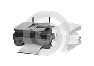 Modern printer and stack of paper on white background