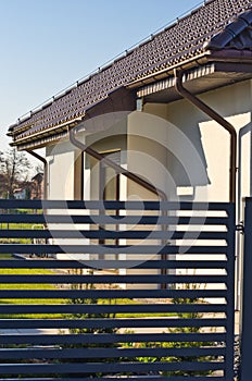 Modern private house with horizontal bars grey steel fence