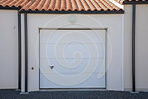 modern private house suburb with garage Home gray up-and-over overhead door grey facade entrance