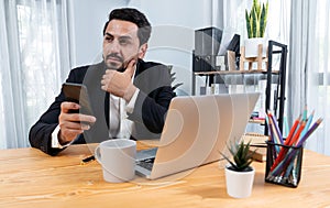 Modern professional businessman at modern office desk. fervent