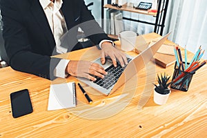 Modern professional businessman at modern office desk. fervent