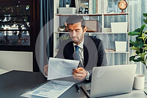 Modern professional businessman at modern office desk. fervent