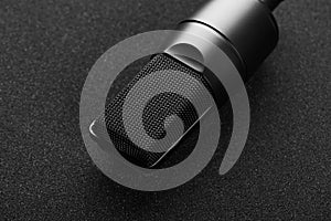 Modern professional microphone on a black background