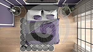 Modern purple colored bedroom in classic room with wall moldings, parquet floor, bed with duvet and pillows, bedside tables,