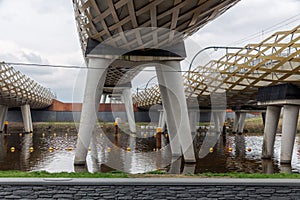 Modern railway bridge across river Dieze in Dutch city s-Hertogenbosch