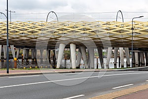 Modern railway bridge across river Dieze in Dutch city s-Hertogenbosch